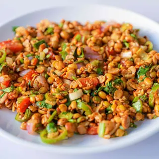 Nepali bhatmas sadheko — crunchy roasted soybeans tossed with onions, tomatoes, green chilies and cilantro