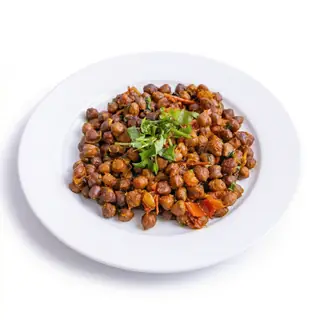 Nepali chana — hearty chickpeas slow-cooked in a spiced onion and tomato gravy at Laliguras Restaurant in Jackson Heights