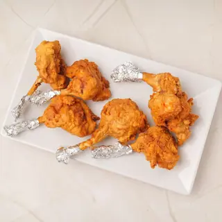 Crispy fried Nepali chicken lollipop wings tossed in a savory, slightly spicy sauce