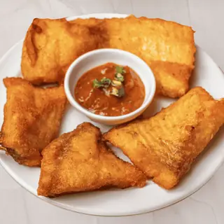Golden crispy Nepali-style fish fry with a crunchy spiced coating, flaky and tender inside