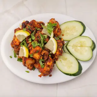 Nepali local chicken fry — crispy free-range bone-in chicken fried with rich, rustic traditional spices