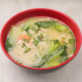 Tibetan beef thenthuk — hand-pulled flat noodle soup simmered with vegetables in a rich broth